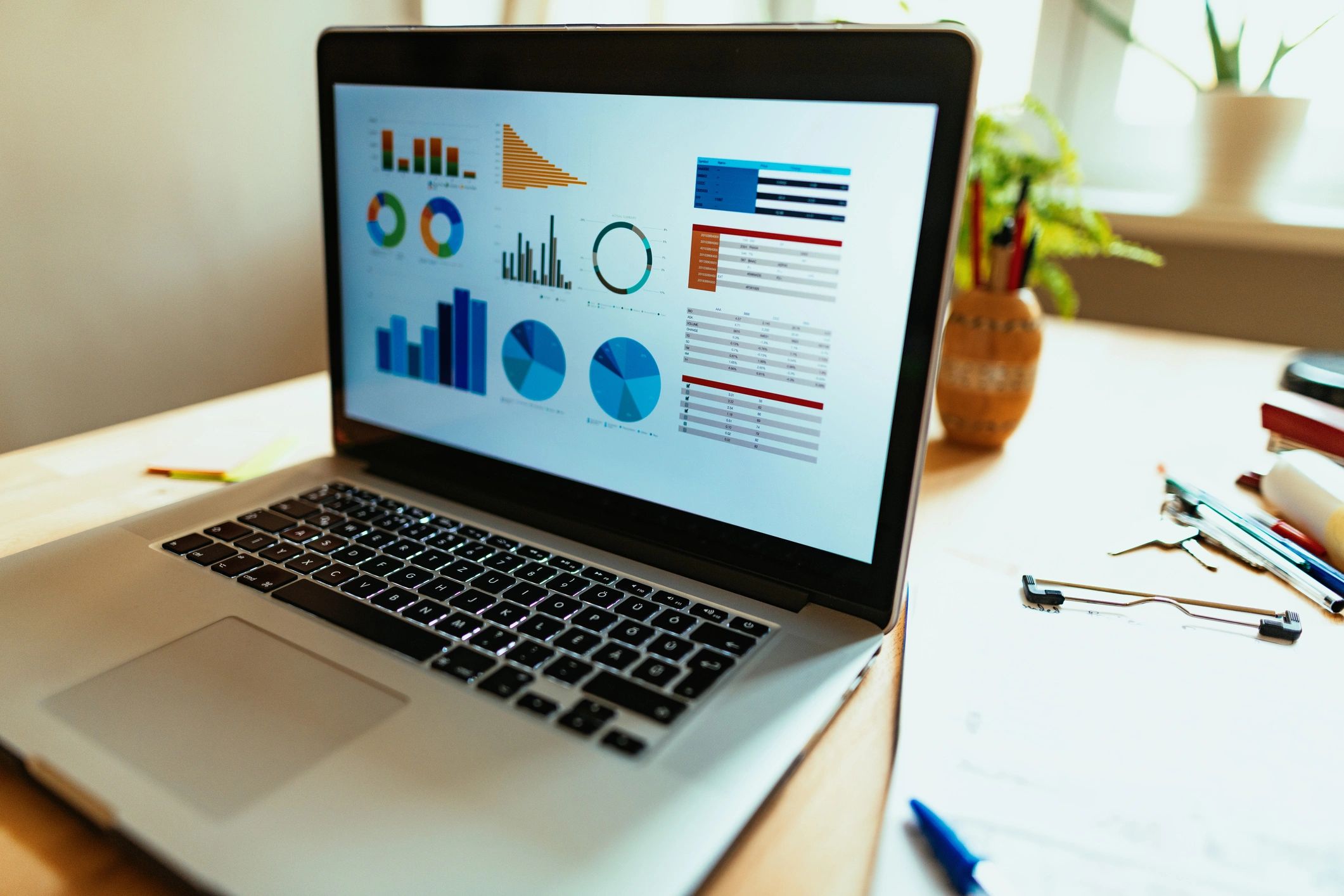Laptop displaying workflow and analytics dashboards