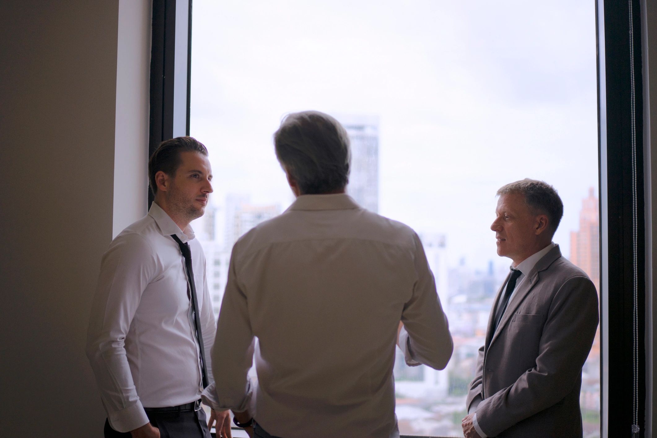 Business professionals reviewing plans in an executive advisory meeting